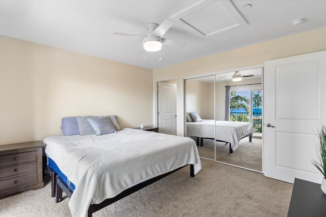 bedroom with ceiling fan, a closet, and light carpet