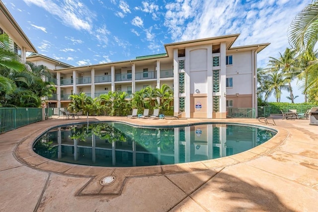 view of swimming pool with a patio