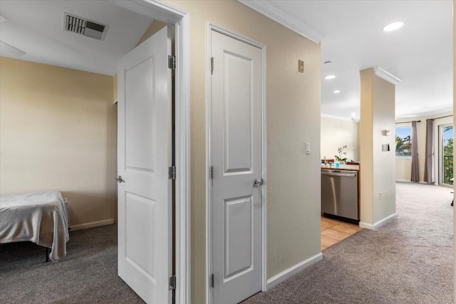 hallway featuring ornamental molding and light colored carpet