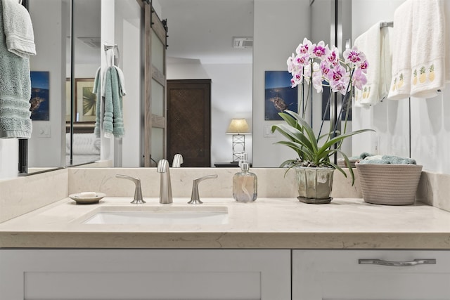 bathroom featuring visible vents and vanity