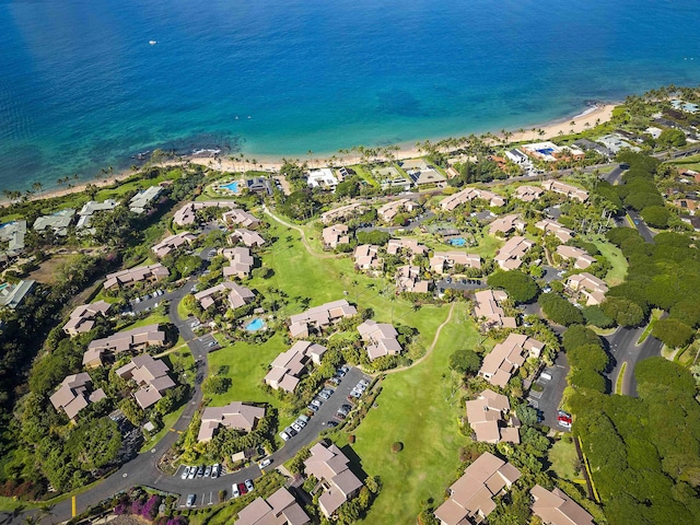 birds eye view of property with a water view, a view of the beach, and a residential view