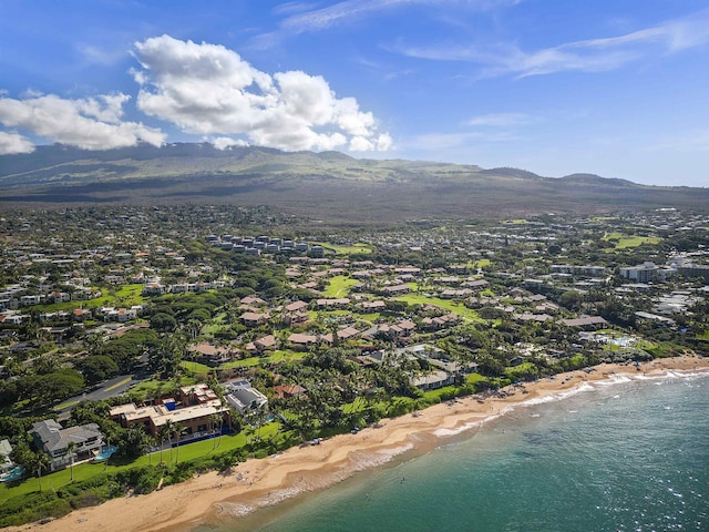 birds eye view of property featuring a beach view and a water and mountain view