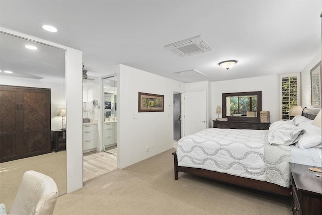 bedroom with recessed lighting and light colored carpet