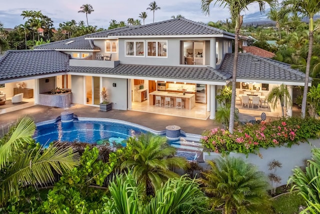 back of house with a patio area