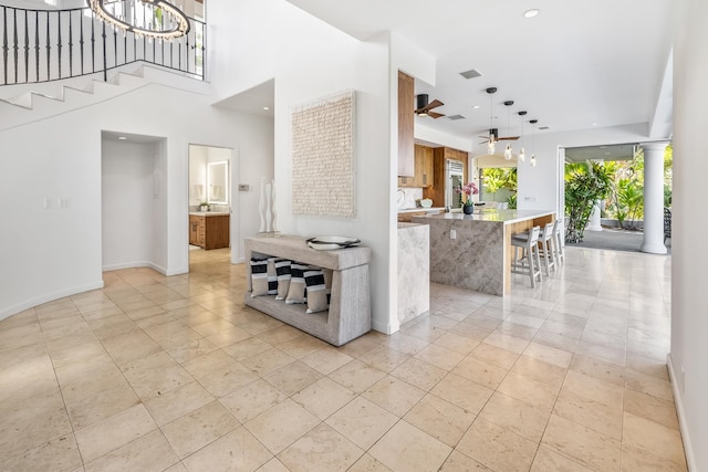 interior space with light tile patterned floors and ornate columns