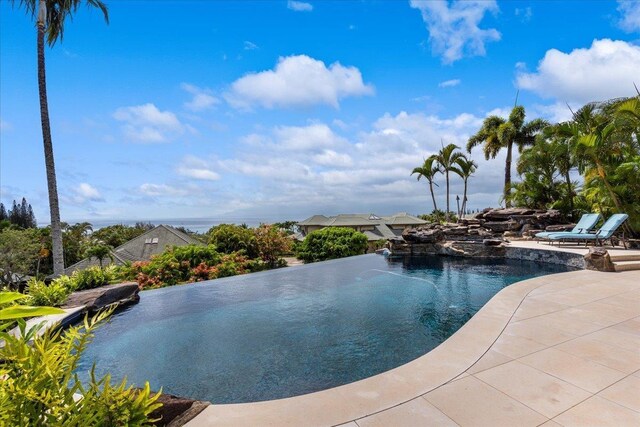 view of swimming pool with a patio