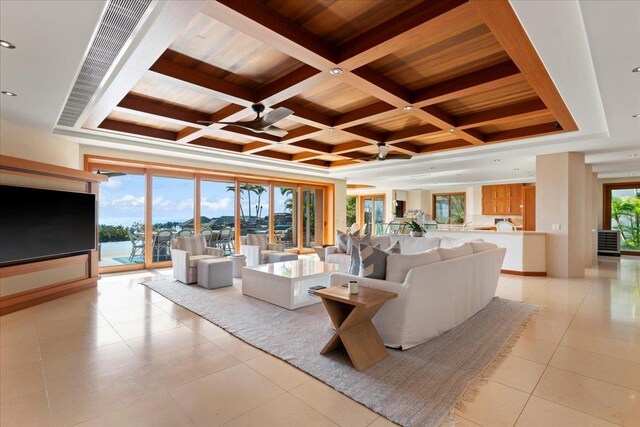 living room with wooden ceiling, light tile patterned floors, beam ceiling, and coffered ceiling