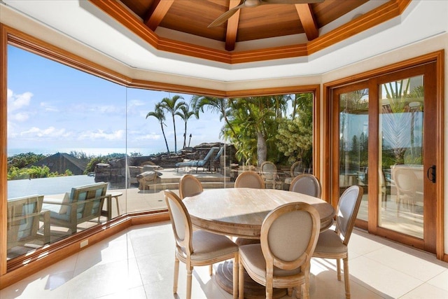 sunroom / solarium featuring a wealth of natural light, beam ceiling, and coffered ceiling