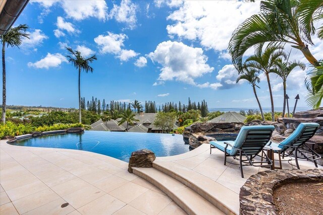 view of pool featuring a patio