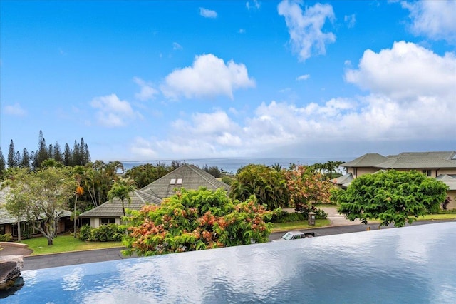 view of pool featuring a water view