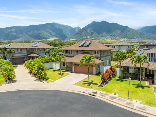 124 Kapela Pl, Kahului, HI 96732 - view of front of property with a mountain view, fence, a residential view, concrete driveway, and a front lawn