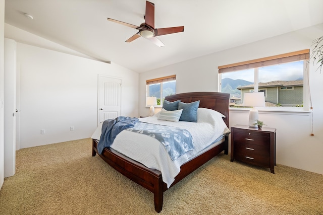 124 Kapela Pl, Kahului, HI 96732 - bedroom with vaulted ceiling, light carpet, and a ceiling fan
