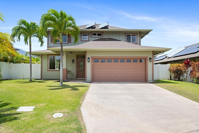 124 Kapela Pl, Kahului, HI 96732 - view of front of house featuring concrete driveway, a front yard, an attached garage, and fence