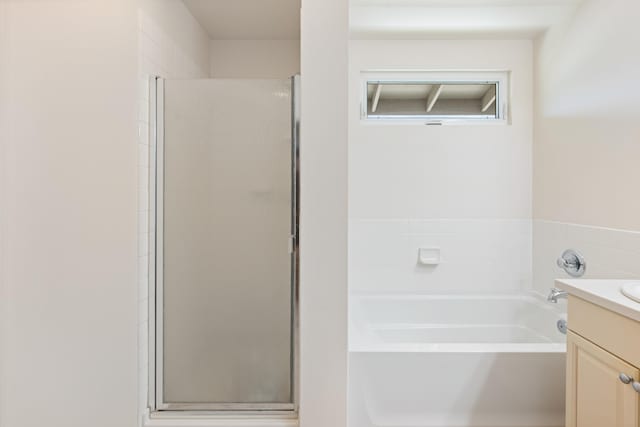 124 Kapela Pl, Kahului, HI 96732 - full bathroom featuring a bath, vanity, and a shower stall