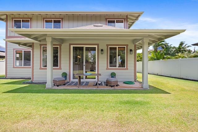 124 Kapela Pl, Kahului, HI 96732 - back of house featuring board and batten siding, a yard, and fence