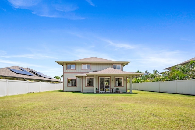 124 Kapela Pl, Kahului, HI 96732 - back of property with a lawn and a fenced backyard