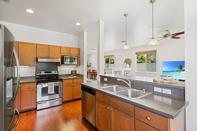 124 Kapela Pl, Kahului, HI 96732 - kitchen featuring a sink, under cabinet range hood, dark countertops, and appliances with stainless steel finishes
