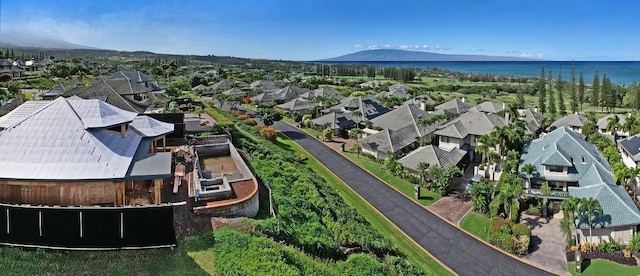 aerial view featuring a water and mountain view