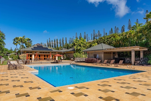 view of swimming pool with a patio area