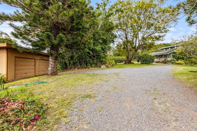 view of yard with a garage