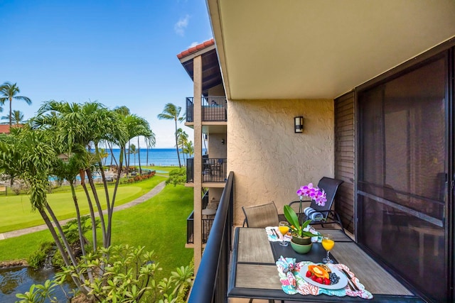 balcony featuring a water view