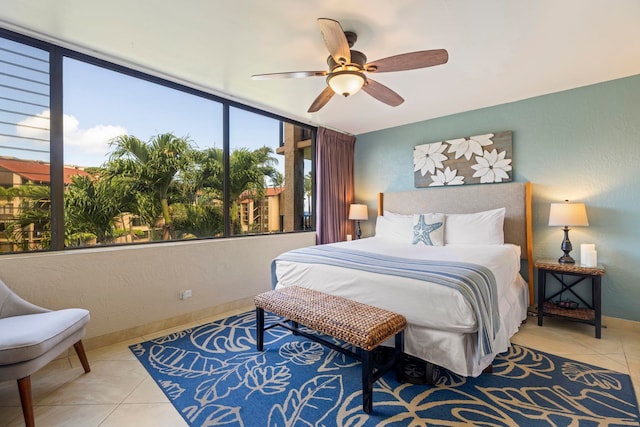 bedroom with tile patterned flooring and ceiling fan