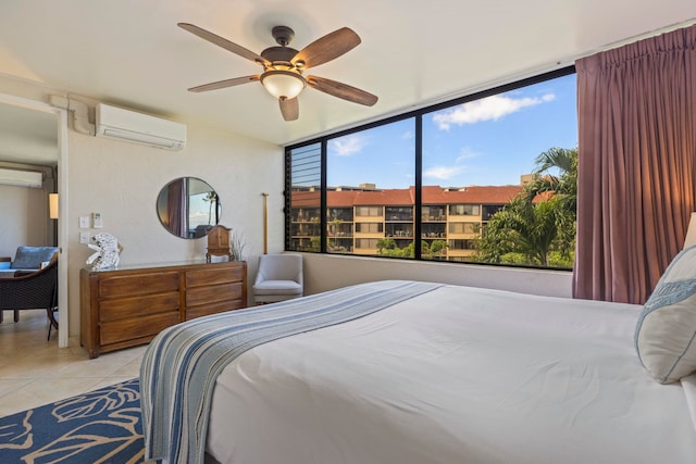 bedroom featuring ceiling fan, light tile patterned flooring, and an AC wall unit