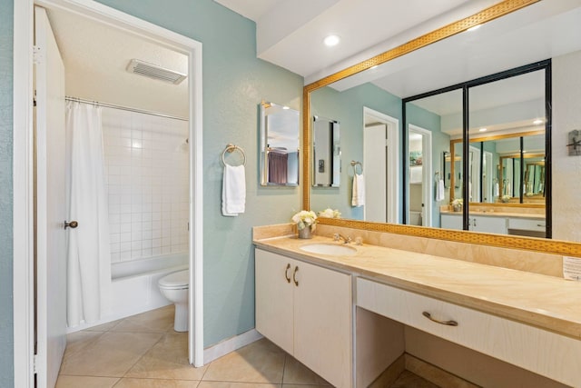 full bathroom with shower / tub combo, vanity, toilet, and tile patterned floors