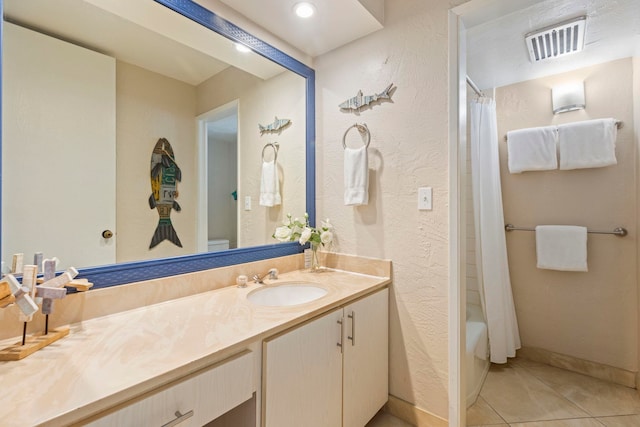 full bathroom with toilet, shower / bath combo, vanity, and tile patterned floors