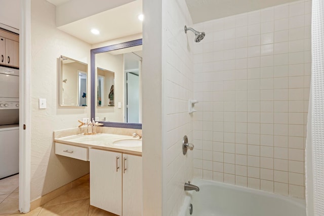 bathroom featuring tile patterned flooring, vanity, shower / tub combo with curtain, and stacked washer and clothes dryer