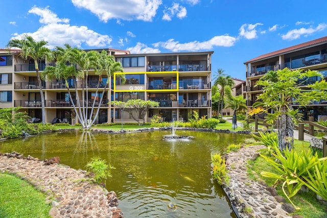 view of building exterior with a water view