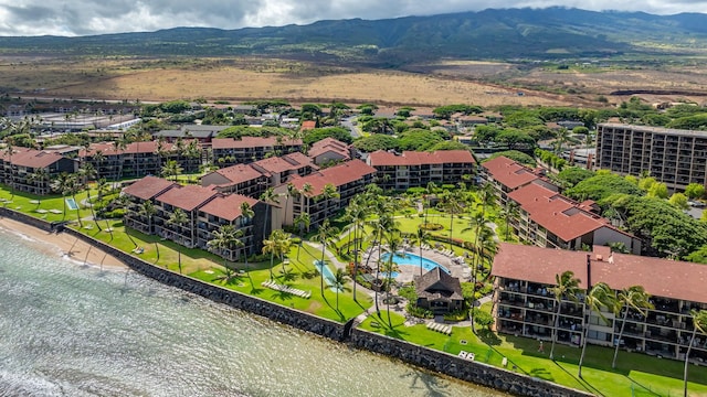 bird's eye view with a water and mountain view