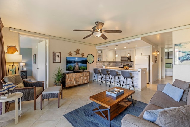 living room with ceiling fan and light tile patterned floors