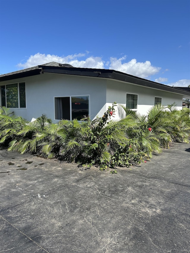 view of property exterior with stucco siding
