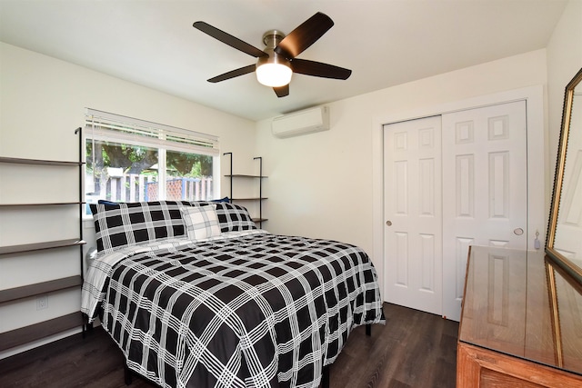 bedroom featuring a wall unit AC, ceiling fan, a closet, and dark hardwood / wood-style flooring