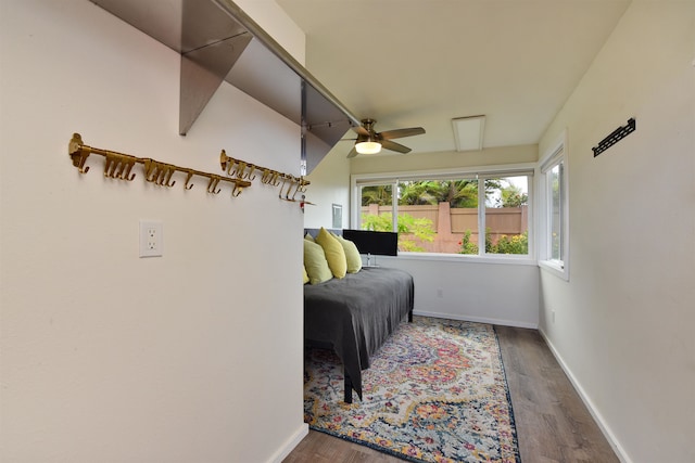 bedroom with ceiling fan and dark hardwood / wood-style flooring