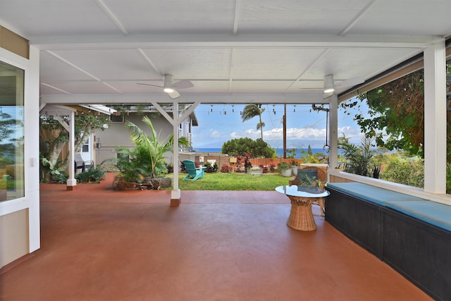 view of patio / terrace featuring ceiling fan and a hot tub