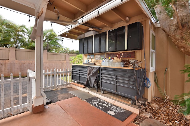 view of patio / terrace featuring a sunroom