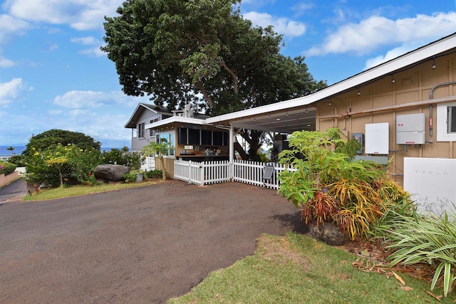 view of property exterior featuring a carport