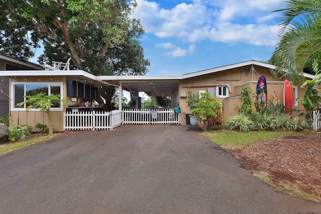 view of front of home featuring a carport