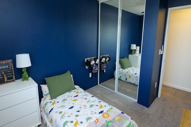 bedroom with carpet floors and a closet