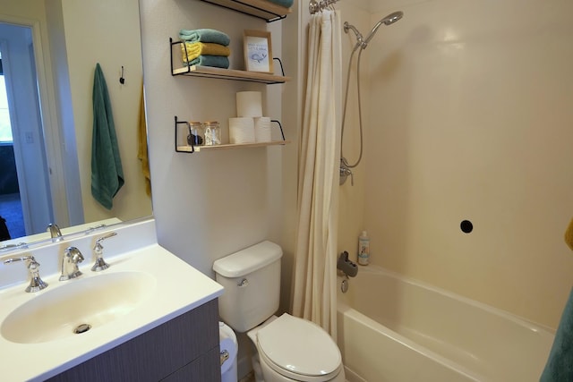 full bathroom featuring shower / bath combination with curtain, vanity, and toilet