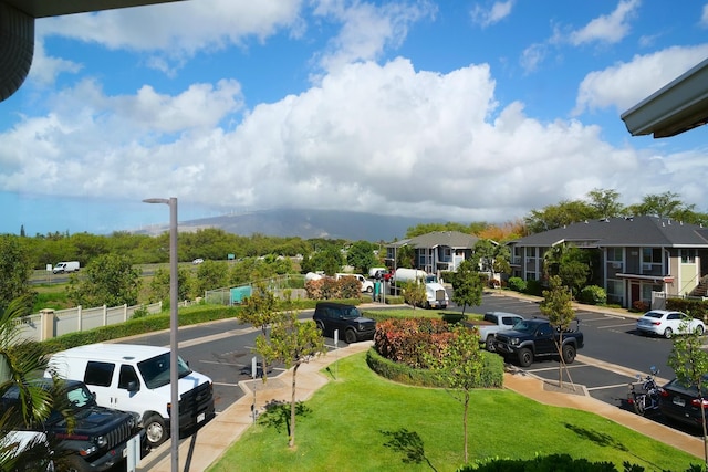 view of home's community with a lawn