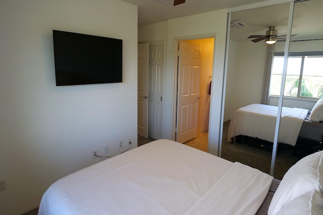 bedroom with ceiling fan and carpet flooring