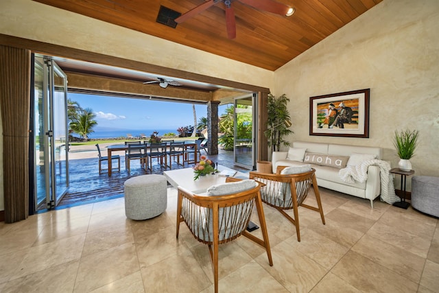 living area with a ceiling fan, lofted ceiling, and wooden ceiling