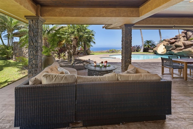 view of patio / terrace with an outdoor living space and an outdoor pool