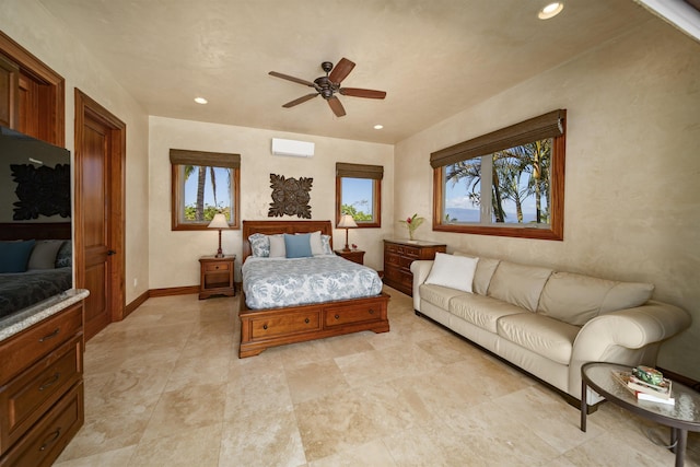 bedroom featuring baseboards, a ceiling fan, a wall unit AC, and recessed lighting