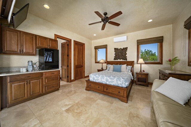 bedroom featuring recessed lighting, an AC wall unit, and multiple windows