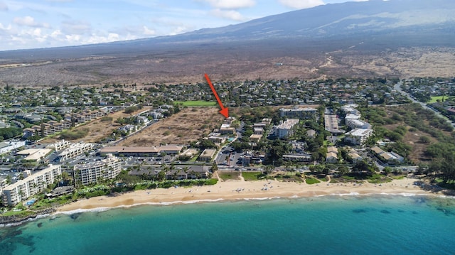 bird's eye view with a view of the beach and a water and mountain view