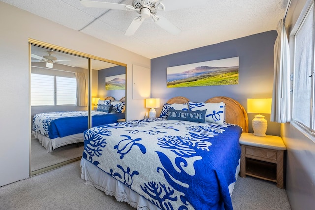 bedroom featuring carpet flooring, ceiling fan, and a closet